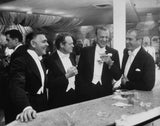 Film stars (left to right) Clark Gable (1901 - 1960), Van Heflin (1910 - 1971), Gary Cooper (1901 - 1961) and James Stewart (1908 - 1997) enjoy a joke at a New Year's party held at Romanoff's in Beverly Hills.