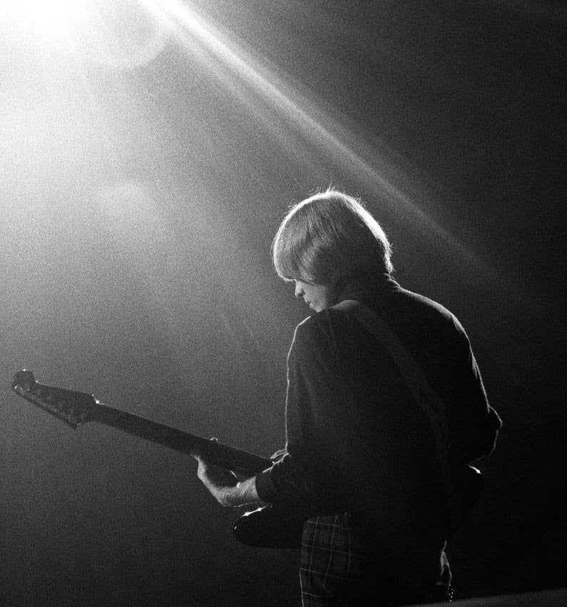 Brian Jones performing on stage 1965.