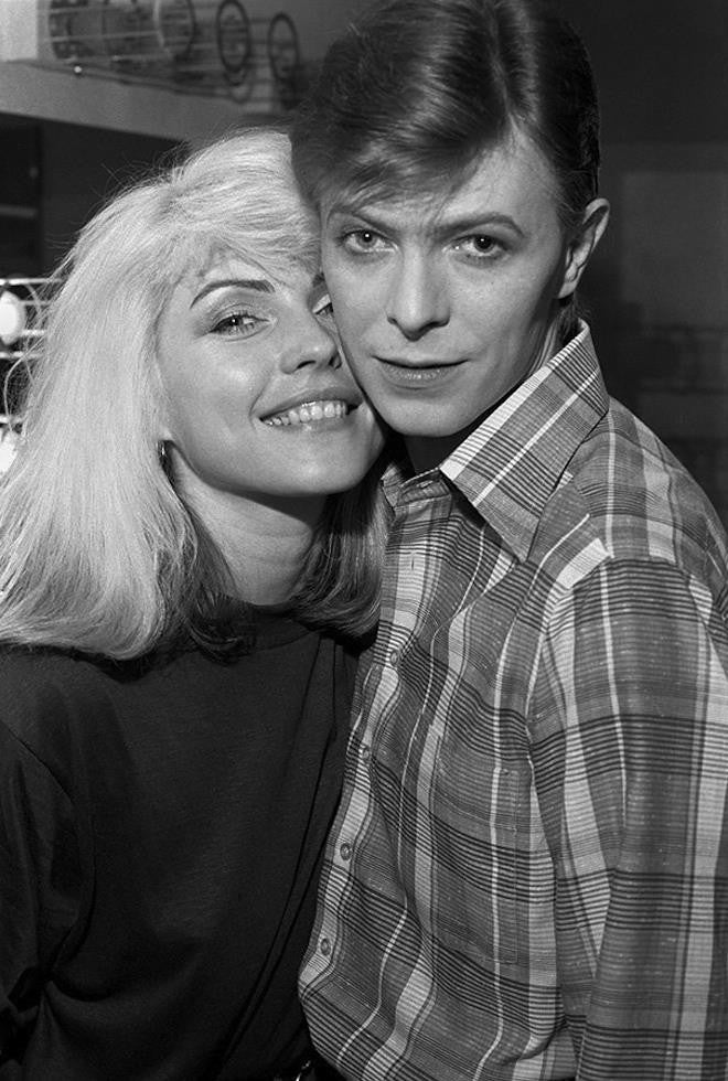 This photo was taken in 1977 and shows Debbie with a young David Bowie backstage during Iggy Pop's Idiot Tour, in which Bowie played the keyboard.