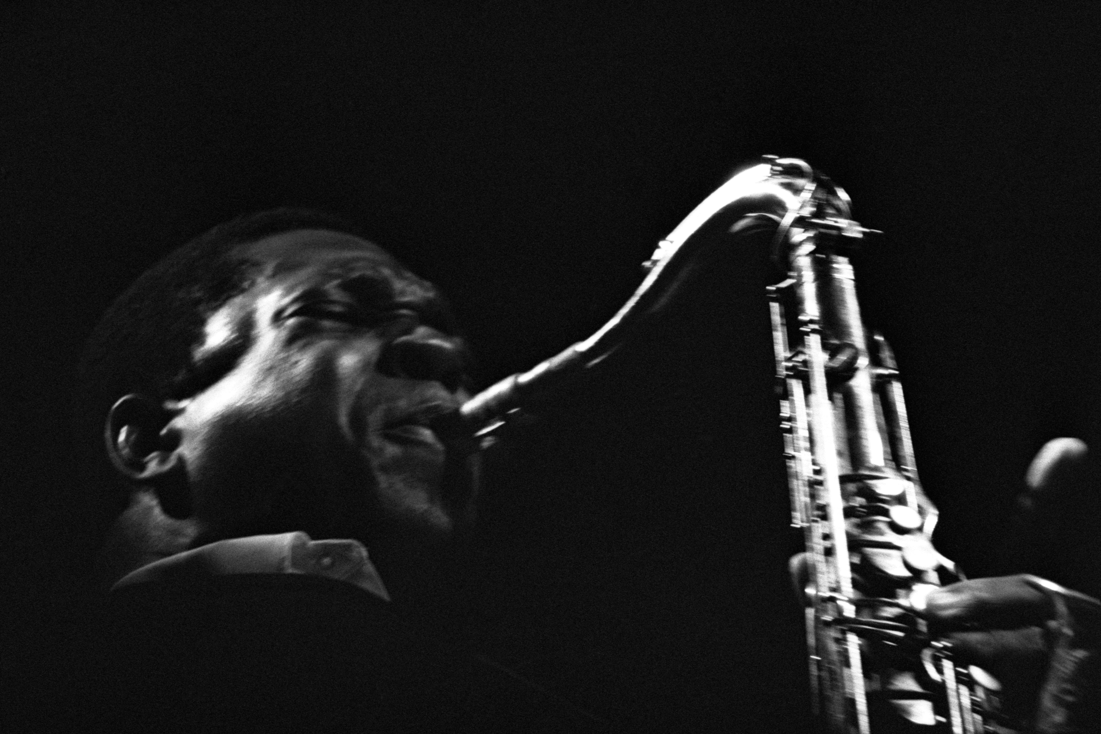 American jazz saxophonist and composer John Coltrane playing the saxophone on stage at Newport Jazz Festival, Rhode Island, US, 1965.