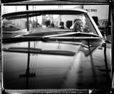 Lucinda Williams sitting in car during photoshoot for Little Honey album cover shoot. 2008