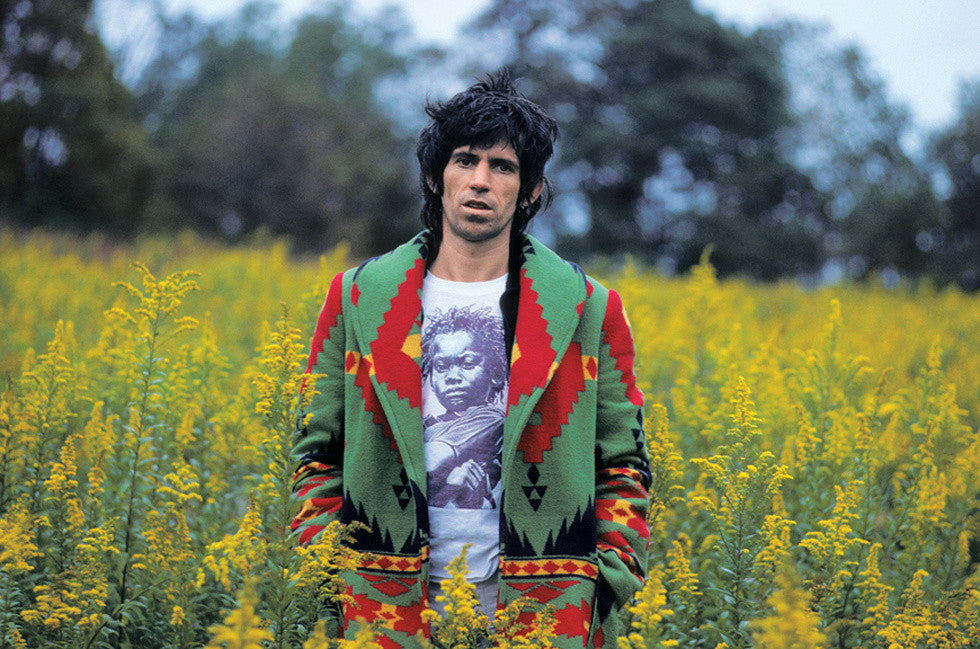Keith Richards in field of grass. 1981