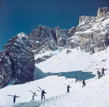 Skiers walk up a mountain in Cortina D'Ampezzo, a ski resort in northern Italy, 1962.
