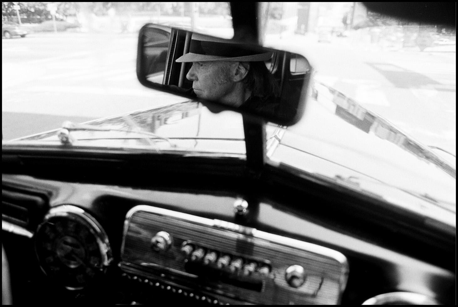 Neil Young driving car.