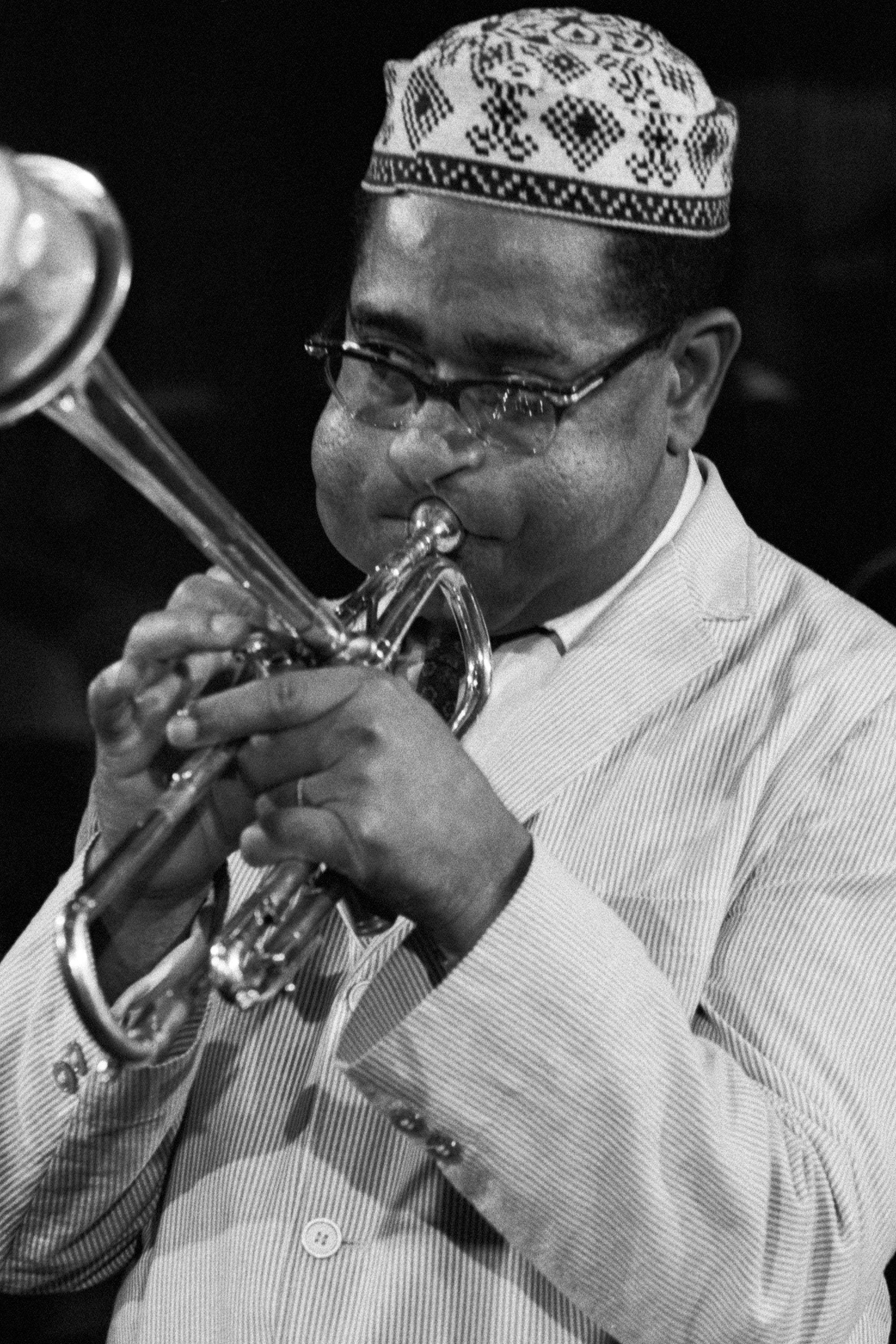 American jazz trumpeter, bandleader, composer and singer John Birks “Dizzy” Gillespie playing the trumpet at Ken Nordine’s jazz TV show in Chicago, US, 1961.