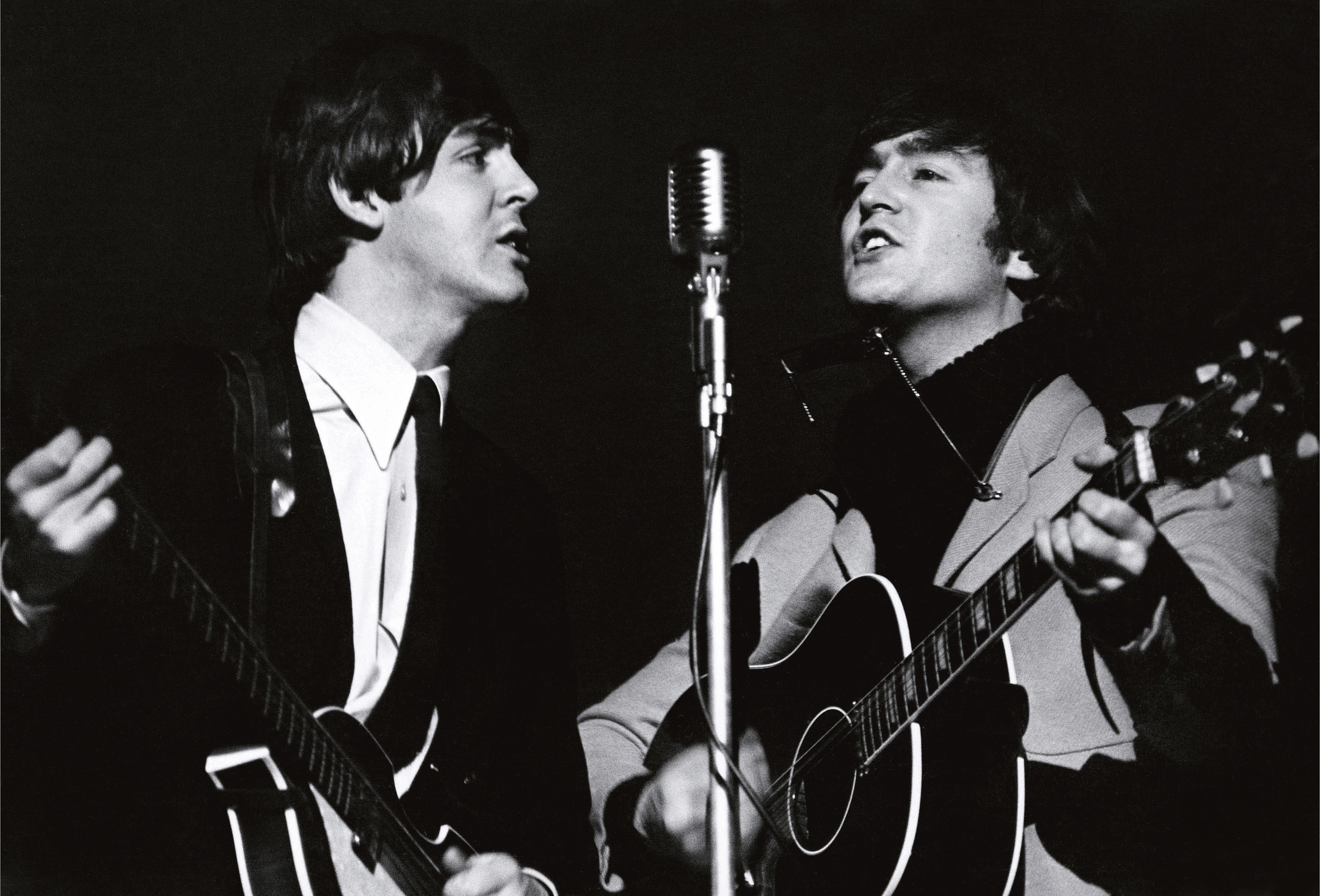 The Beatles’ Paul McCartney and John Lennon rehearse for a TV special at Wembley Studios in April 1964.