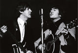 The Beatles’ Paul McCartney and John Lennon rehearse for a TV special at Wembley Studios in April 1964.
