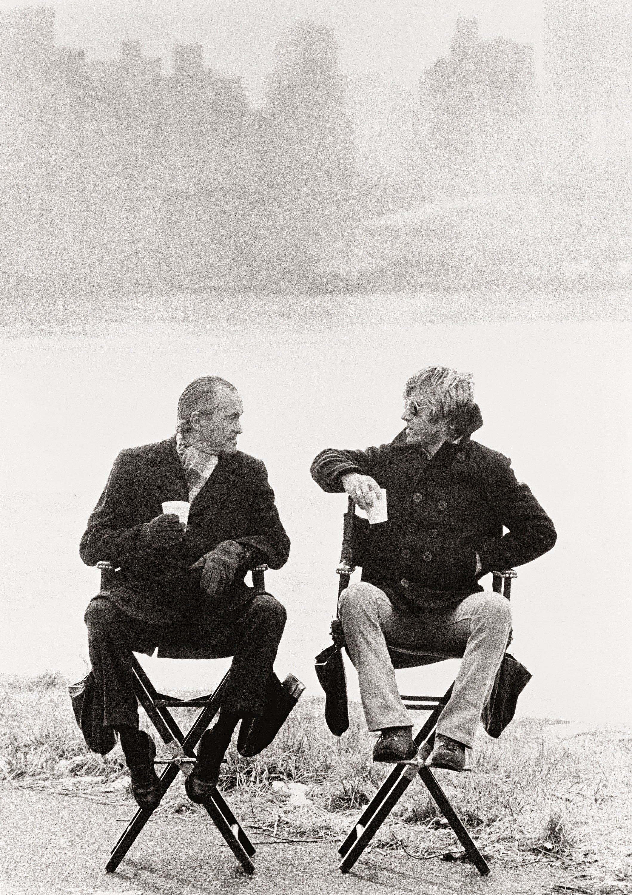 Actor Robert Redford having a conversation with Richard Helmes, then head of the CIA, during the filming of ‘Three Days of the Condor’ on Rykers Island, New York City, 1975.