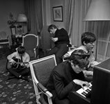 The Beatles composing in hotel room in Paris, France. 1964