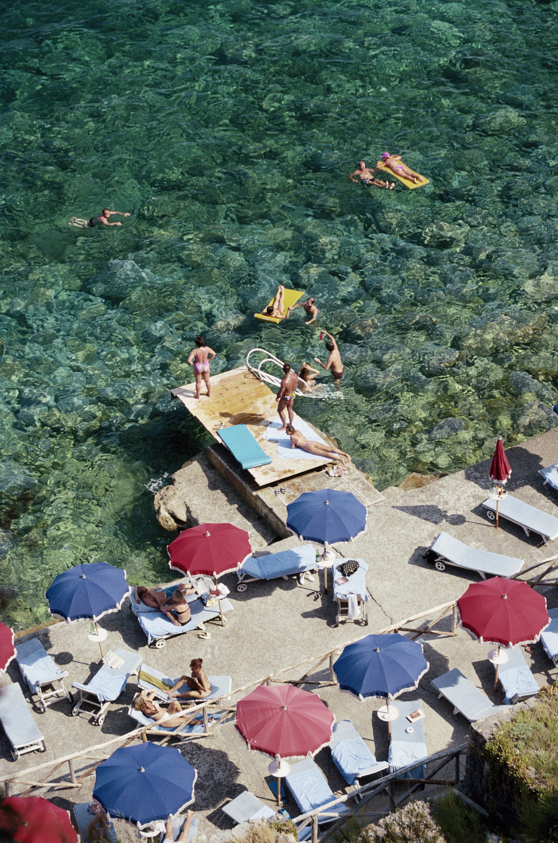 A jetty juts out from a rocky shoreline in Porto Ercole, Tuscany, July 1991.