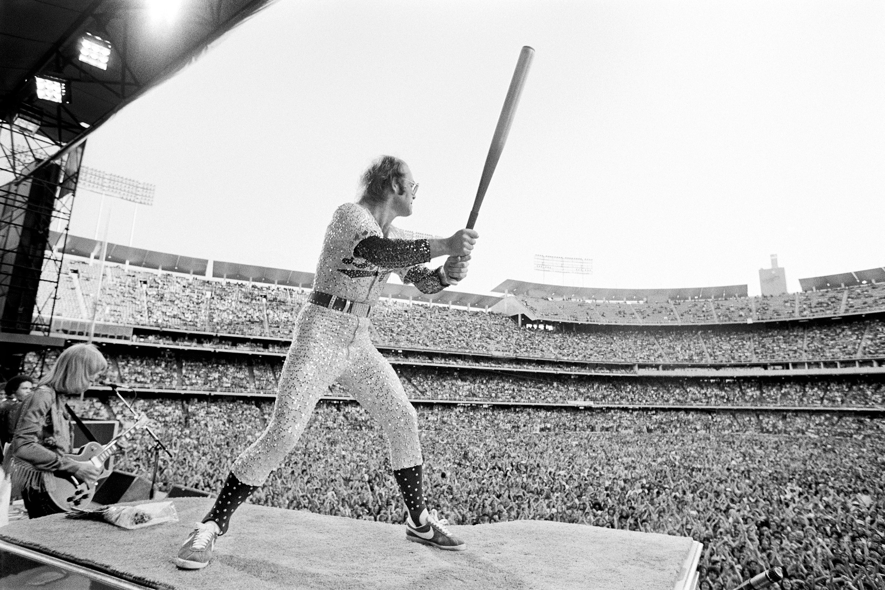 English singer and songwriter Elton John performs at Dodger Stadium in Los Angeles, October 1975.