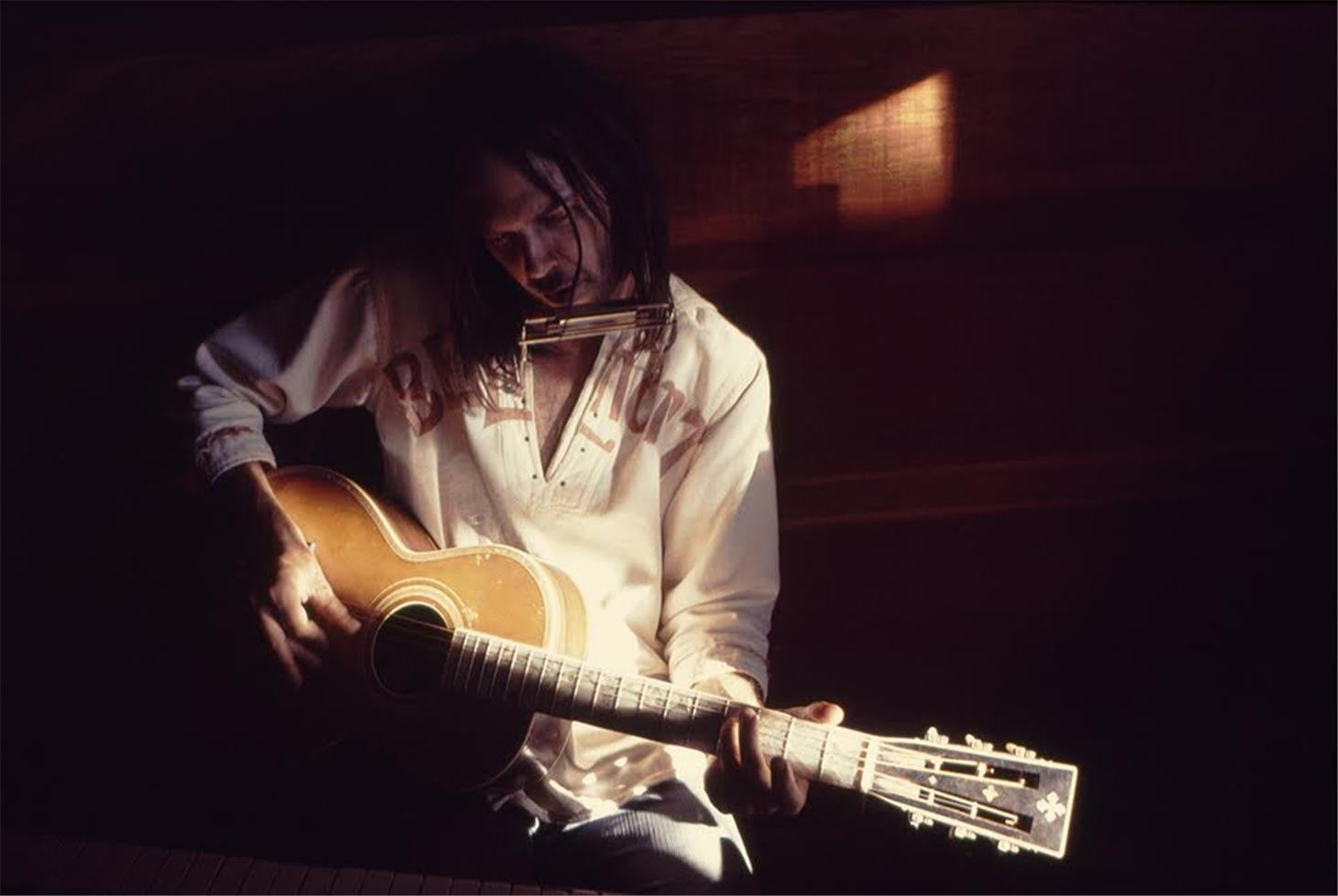 Neil Young playing Washburn guitar. Broken Arrow Ranch, CA. 1973