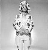 English singer and songwriter Elton John at at photo shot for his "Honkey Chateu" album. 1972