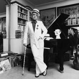 English singer and songwriter Elton John at his home in Wentworth, UK. 1975