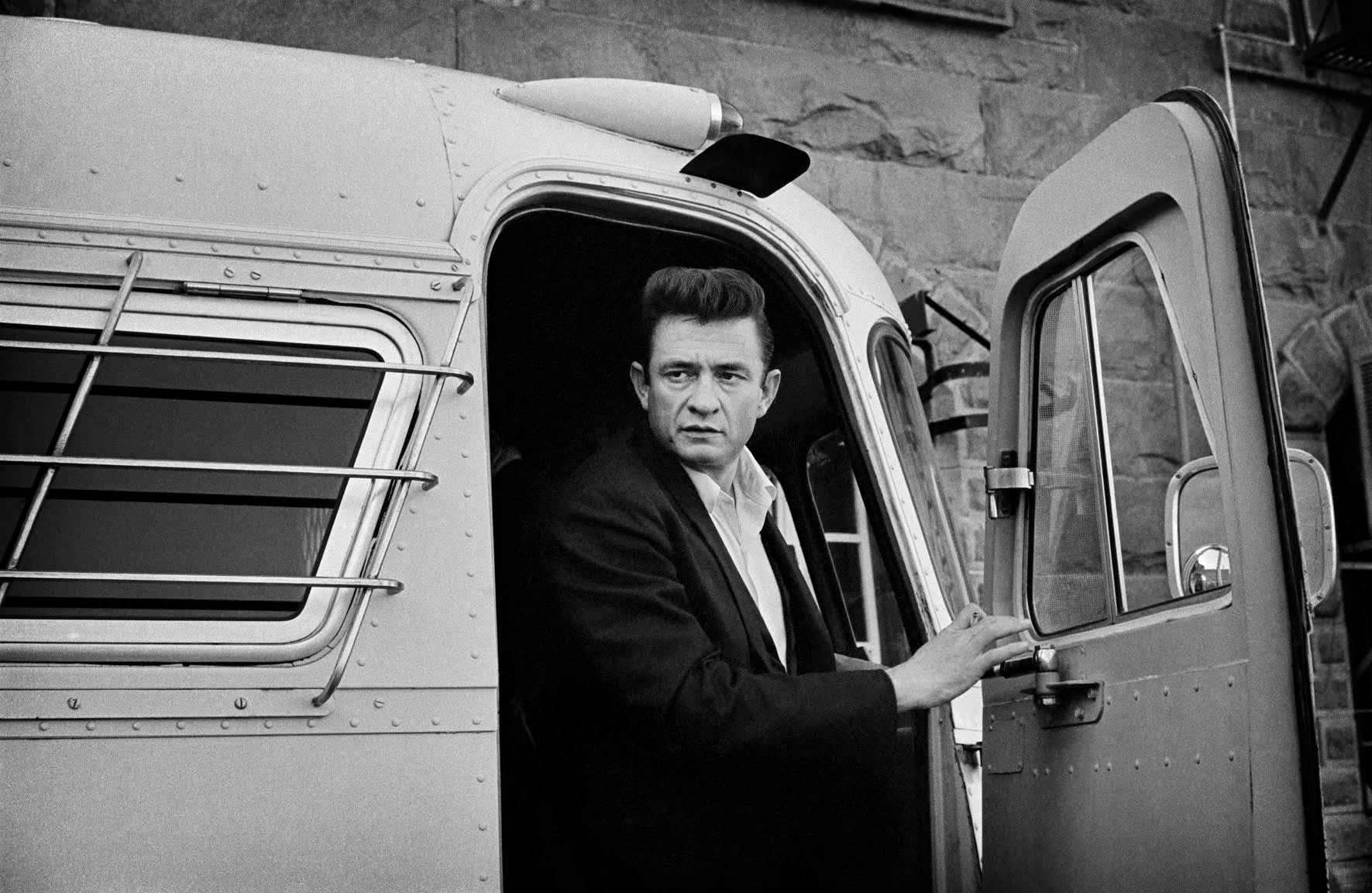 Johnny Cash exiting bus at Folsom prison. 1968