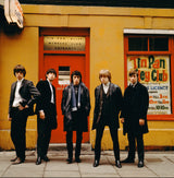 The Rolling Stones line up outside the Tin Pan Alley Club in London, 1963.