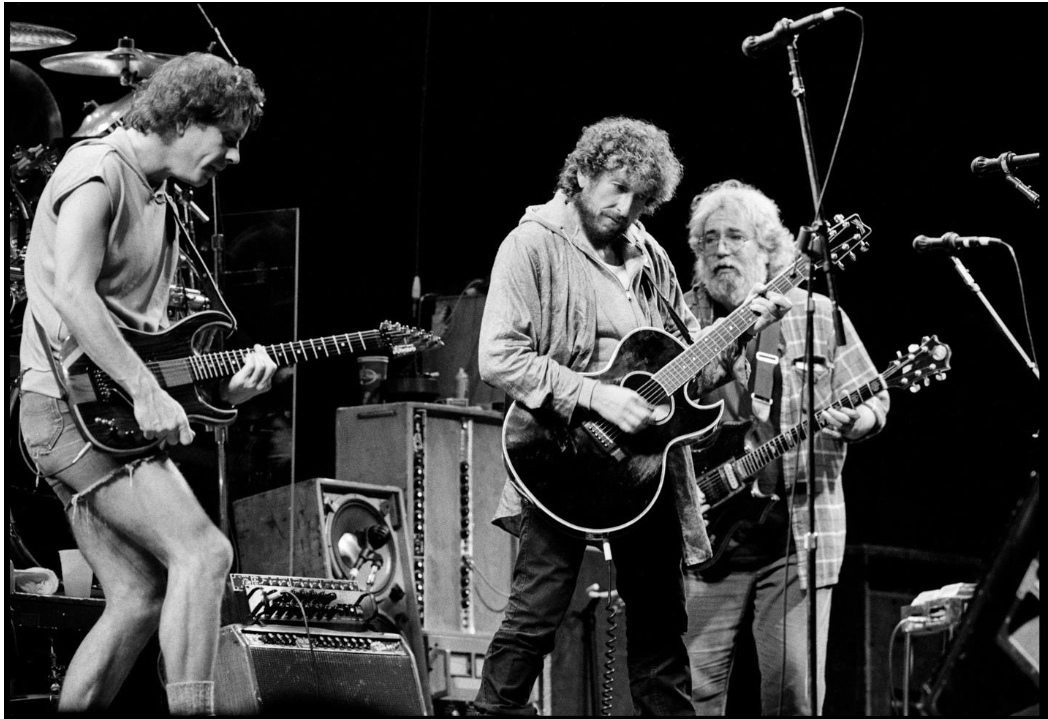 Bob Dylan, Bob Weir and Jerry Garcia perfroming at Oakland Stadium, CA. 1987