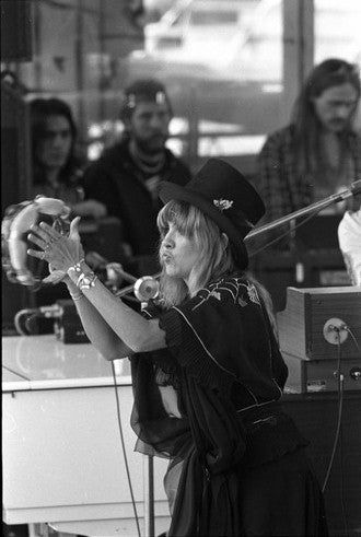 Stevie Nicks performing on stage at the Oakland Coliseum, CA. 1976.