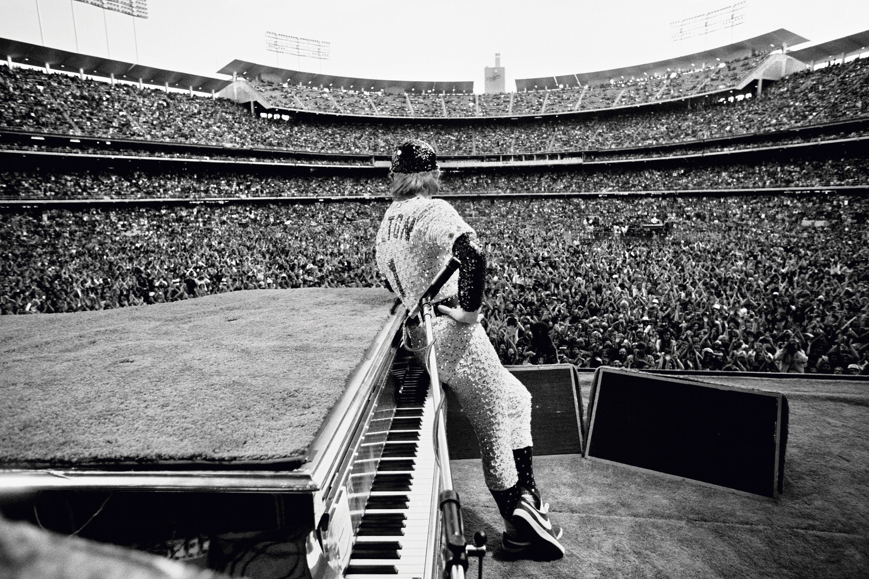 English singer and songwriter Elton John performs at Dodger Stadium in Los Angeles, October 1975.