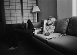 Gregg Allman sitting on couch while being interviewed by Cameron Crowe for Rolling Stone magazine. San Francisco, CA. 1973