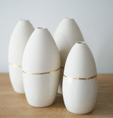 White vase with metallic gold accent