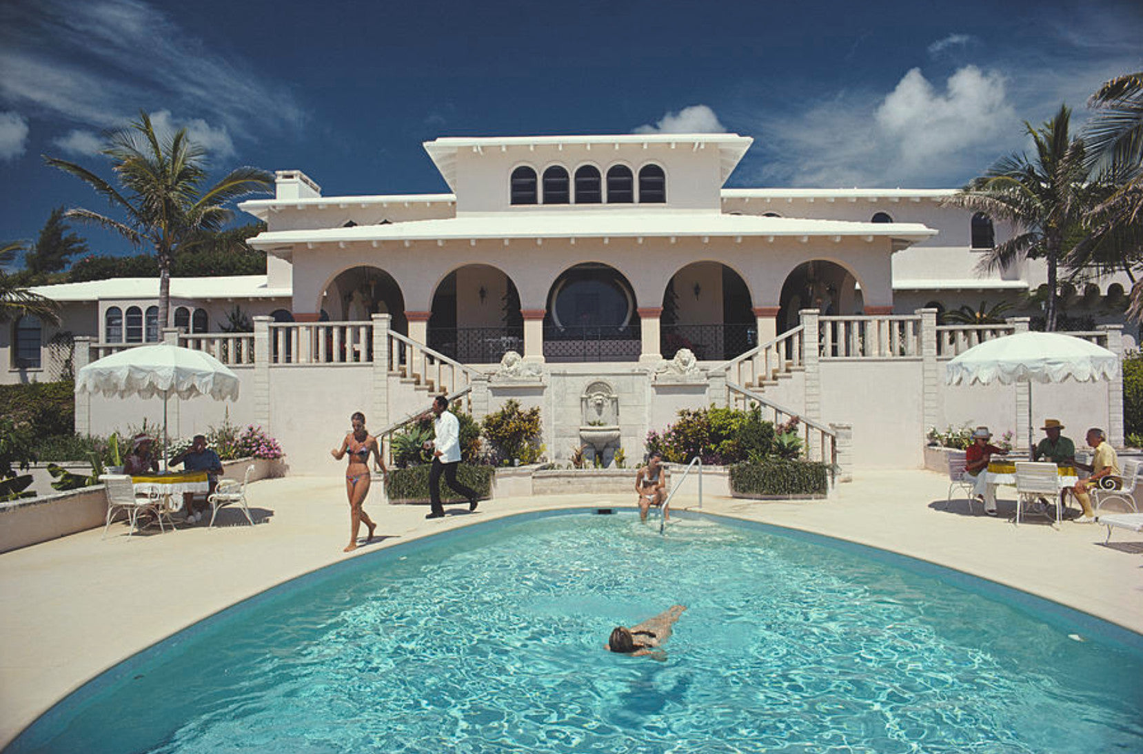 Guests around the pool at Elephant Walk, Duncan McMartin's villa in Bermuda, September 1977. 