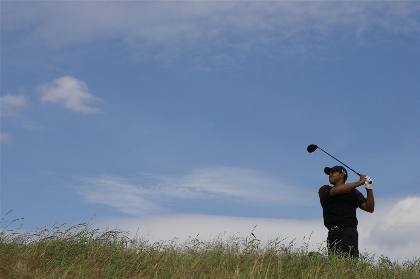 Tiger Woods swings his club during Round 4 of the 2005 British Open at the Old Course in St. Andrews, Scotland.