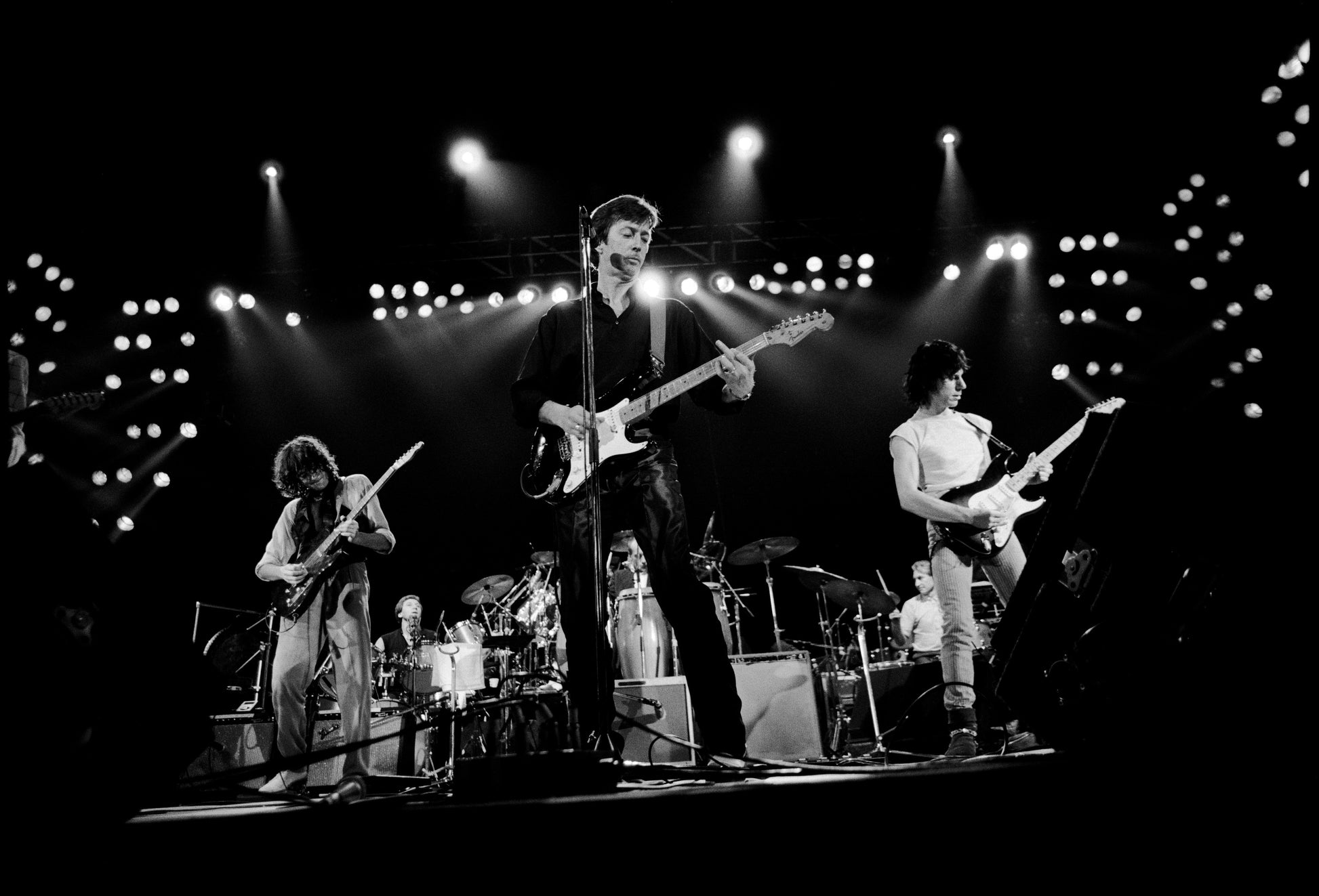 Jimmy Page, Eric Clapton and Jeff Beck perform on stage. 1975