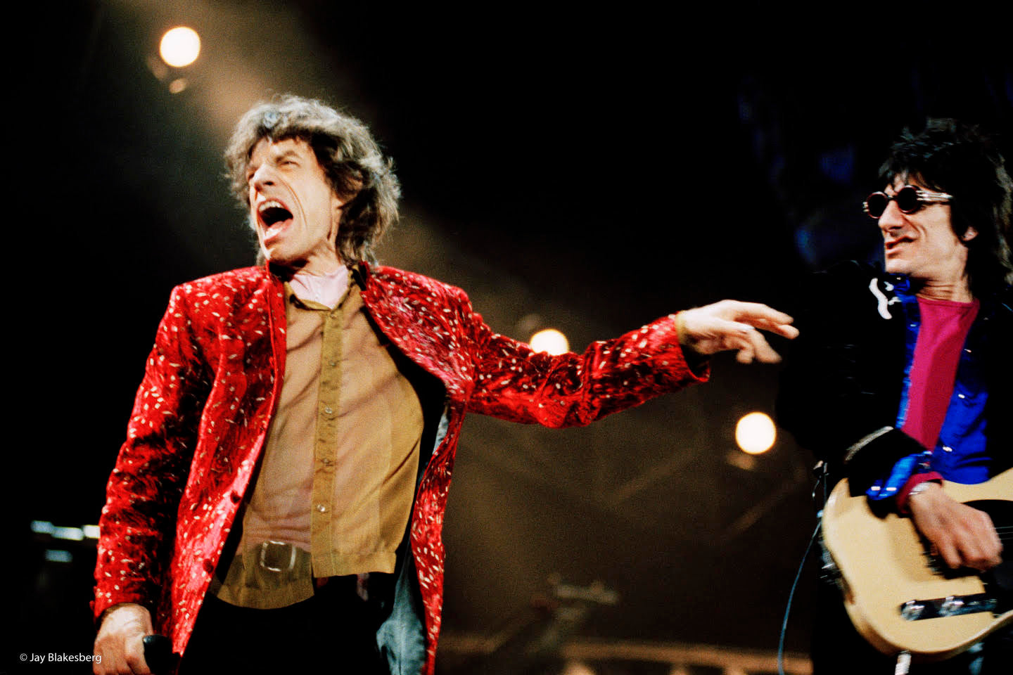 Mick Jagger and Ronnie Wood of the Rolling Stones performing on stage.