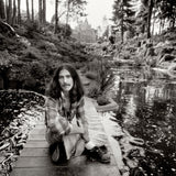 Singer, guitarist and songwriter George Harrison (1943 – 2001) in the grounds of his home, Friar Park, near Henley-on-Thames, south Oxfordshire, 1975.