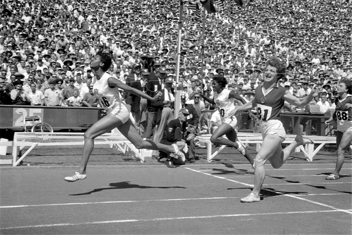 July 22nd, 1962 - USA's Wilma Rudolph in action, crossing the finish line to win the Women's 100m race at Stanford Stadium during a US/USSR track meet.