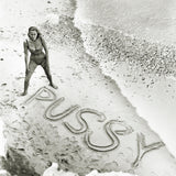 English actress Honor Blackman on a beach for a publicity shot for the 1964 James Bond ‘Goldfinger’. Spelt out in the sand is the name of her character, Pussy Galore.