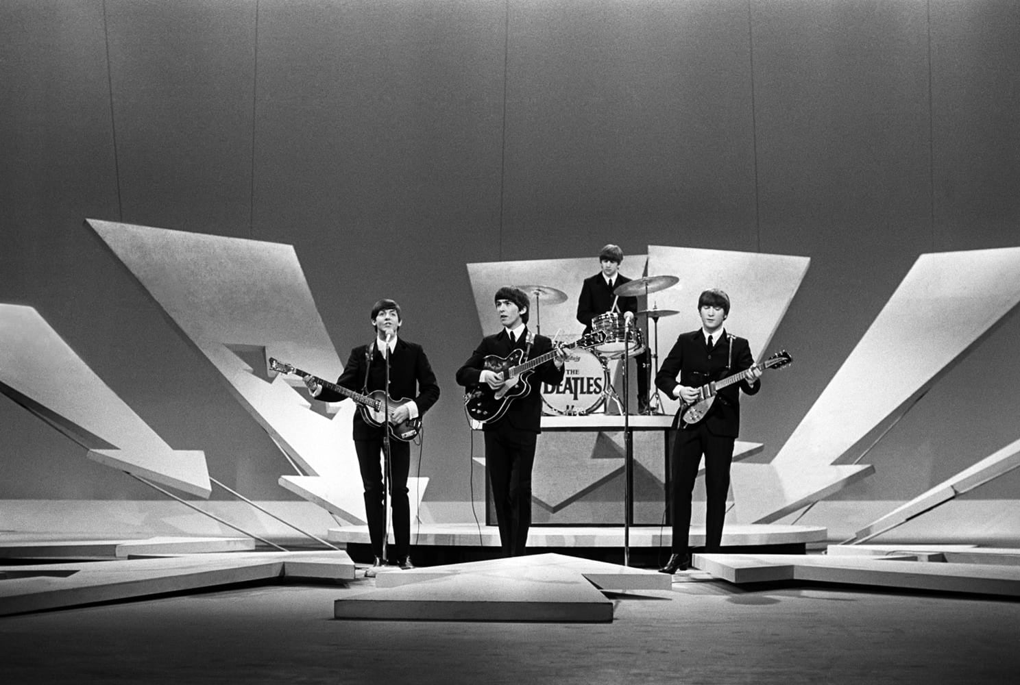 The Beatles performing on the Ed Sullivan show in New York City. 1964