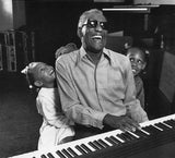 Ray Charles with granddaughters in home studio. 1990