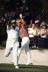 Jack Nicklaus and his caddie Willie Peterson celebrate after making a birdie putt on the 16th green during Round 1 of the 1972 Masters Tournament at Augusta National GC.
