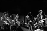 Bob Dylan,Tom Petty and Willie Nelson performing with the Heartbreakers at Farm Aid in Champaign, Illinois on September 22, 1985.