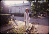 Bruce Springsteen standing outside his childhood home.

Freehold, NJ. 1979